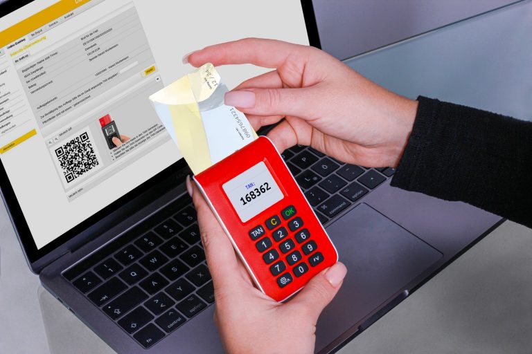 Hardware OTP token displaying a 6-digit TOTP code in front of a laptop, representing two-factor authentication for automated bot sessions. Photo by Pexels.