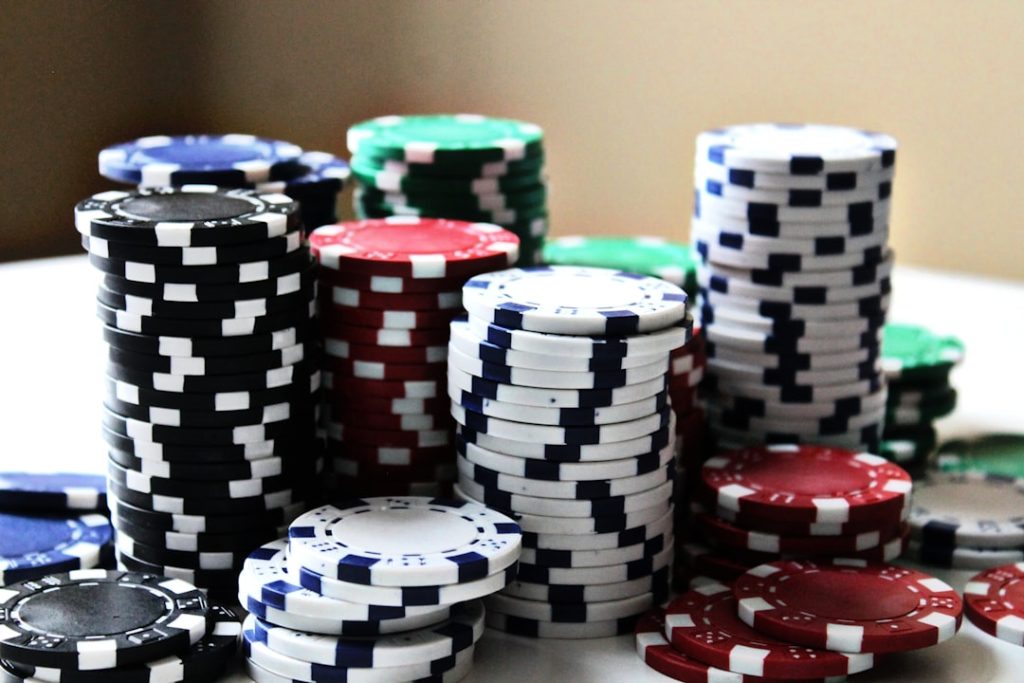 photo-1542145272-597f274b38abjpg - StakeProSoft Stacked colourful casino chips representing betting strategy and bankroll management