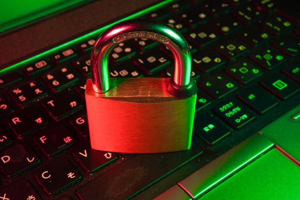 A padlock resting on a glowing gaming keyboard, representing the cryptographic server seed locking mechanism behind Stake's provably fair dice rolls.